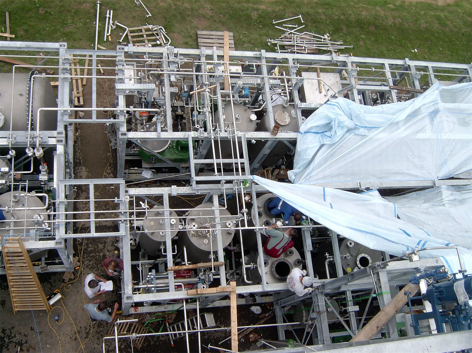 Galvanised module frames of the biodiesel plant with vessels and piping during assembly, seen from above